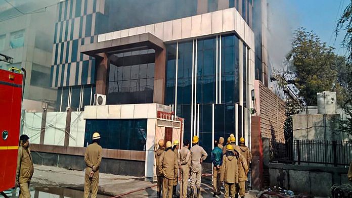 Firefighters at the spot where a fire broke out at a factory in Delhi's Peeragarhi, Thursday,02 Jan , 2019. 14 people, including 13 firefighters, injured in the incident. | PTI