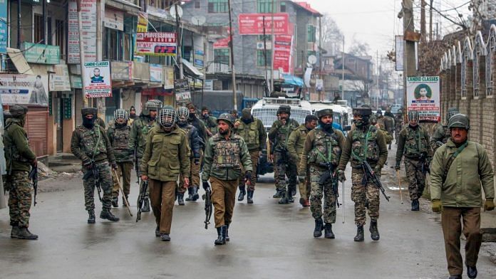 Security personnel patrol a street after clashes which erupted after a police vehicle collided with a car in an accident killing a 10th class student Tehseen Ahmed Bhat | PTI