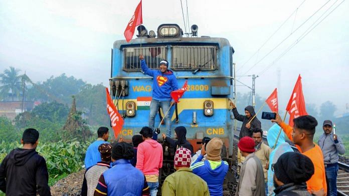 Members of AITUC and INTUC block a train during the trade unions nationwide strike in West Midnapore district of West Bengal | PTI
