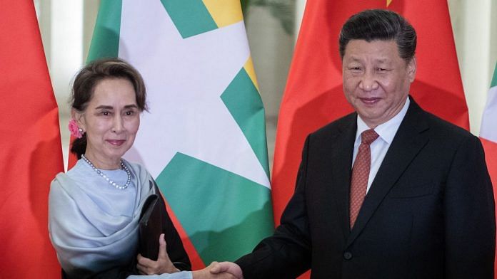 Chinese President Xi Jinping (R) shakes hand of Myanmar State Counsellor Aung San Suu Kyi during a meeting at the Great Hall of the People in Beijing on April 24, 2019 in Beijing, China. | Bloomberg