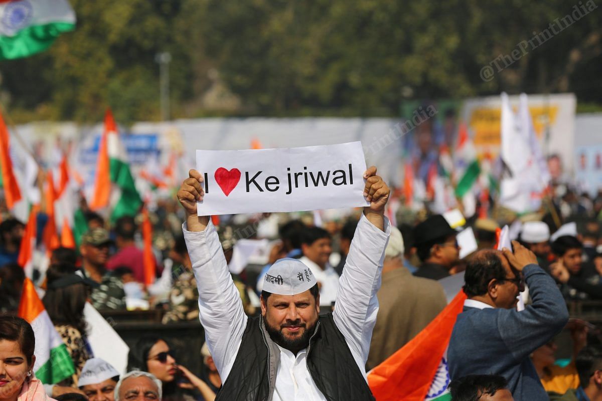 An Aam Aadmi supporter holds I love Kejriwal poster at swearing in ceremony | Photo: Suraj Singh Bihst | ThePrint