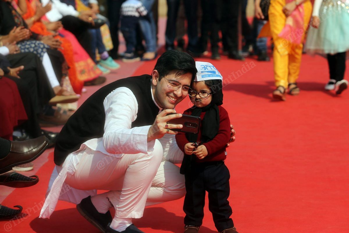 AAP spokesperson and MLA Raghav Chadha clicks a selfie with baby Kejriwal | Photo: Manisha Mondal | ThePrint
