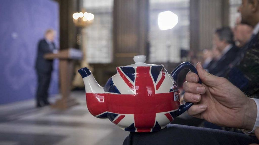 Jonathan Jones, managing director of trading at Tregothnan, holds a teapot featuring the design of a British Union flag, also known as a Union Jack, as he attends a speech by UK Prime Minister Boris Johnson at the Old Royal Naval College in London on 3 February 2020 | Jason Alden | Bloomberg