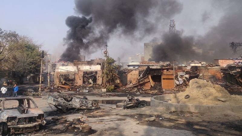 Smoke rises from buildings in Gokulpuri, one of the Northeast Delhi areas worst affected by communal riots