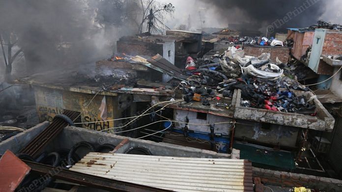 Smoke rises from buildings during violence in Northeast Delhi | Photo: Manisha Mondal | ThePrint