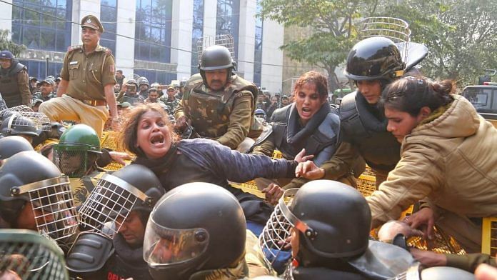 Students of Jamia Milia Islamia clash with police during an anti-CAA protest Monday