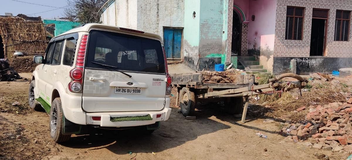 A SUV parked alongside a bullcart in Rohi village, Jewar | Photo: Sajid Ali | ThePrint