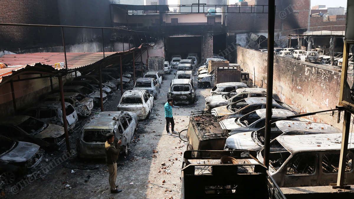 The burnt-out parking lot in Shiv Vihar | Photo: Manisha Mondal | ThePrint