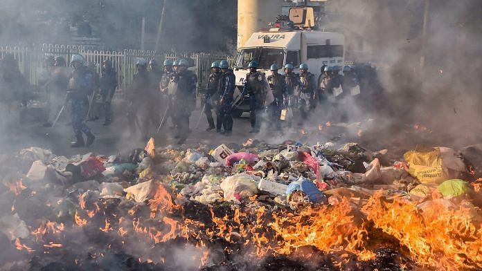 Security personnel conduct flag march during clashes between those against and those supporting the Citizenship (Amendment) Act in north east Delhi | PTI