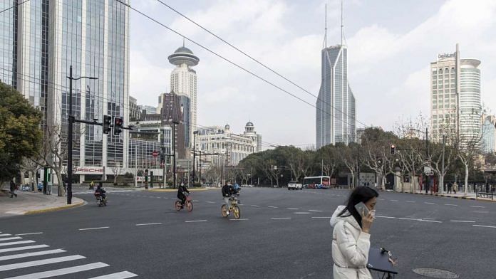 The empty Nanjing Road which is usually a busy commercial street in Shanghai, China | Qilai Shen | Bloomberg