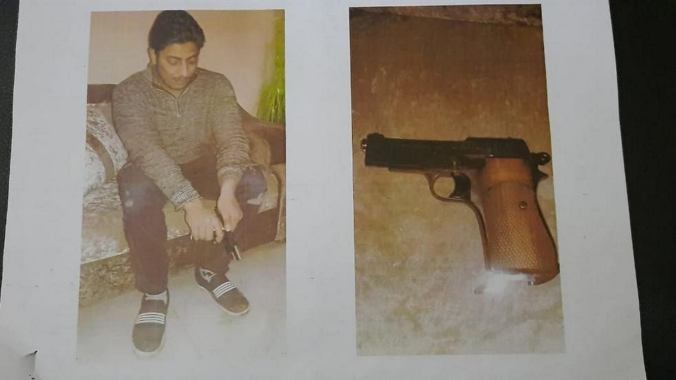 A photograph of Baisala with the gun he allegedly used. Police claim they retrieved this from his phone | Delhi Police 