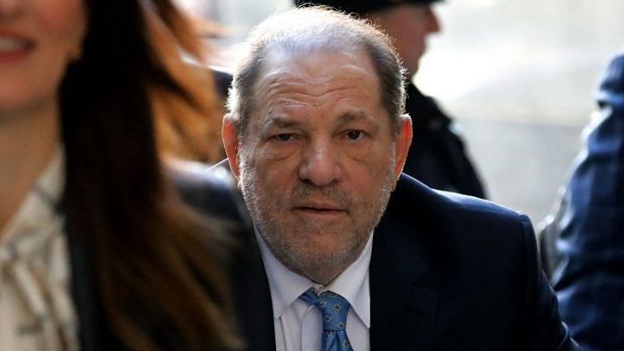 Harvey Weinstein, former co-chairman of the Weinstein Co., center, arrives at state supreme court in New York, U.S | Photographer: Peter Foley | Bloomberg