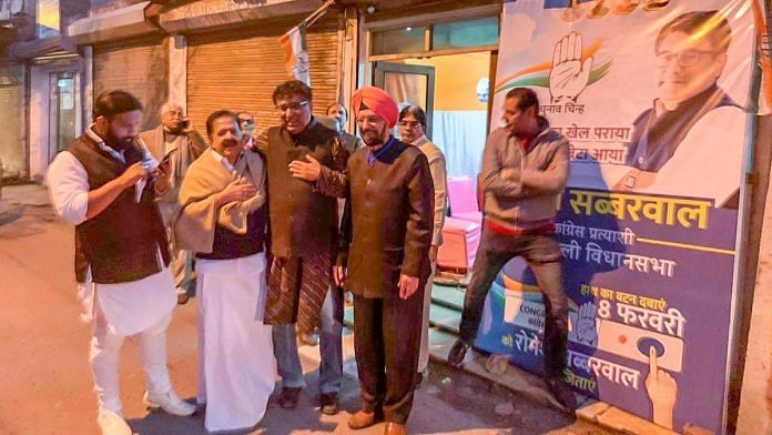 Romesh Sabharwal (C) with other party leaders outside his election office | @RomeshSabharwal | Twitter