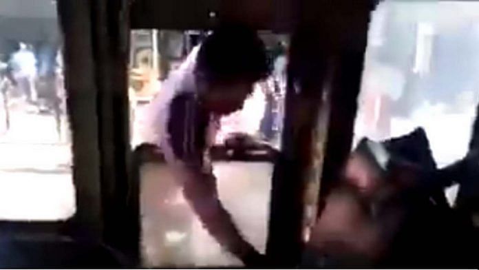 Screengrab of the video of a mob assaulting a bus driver