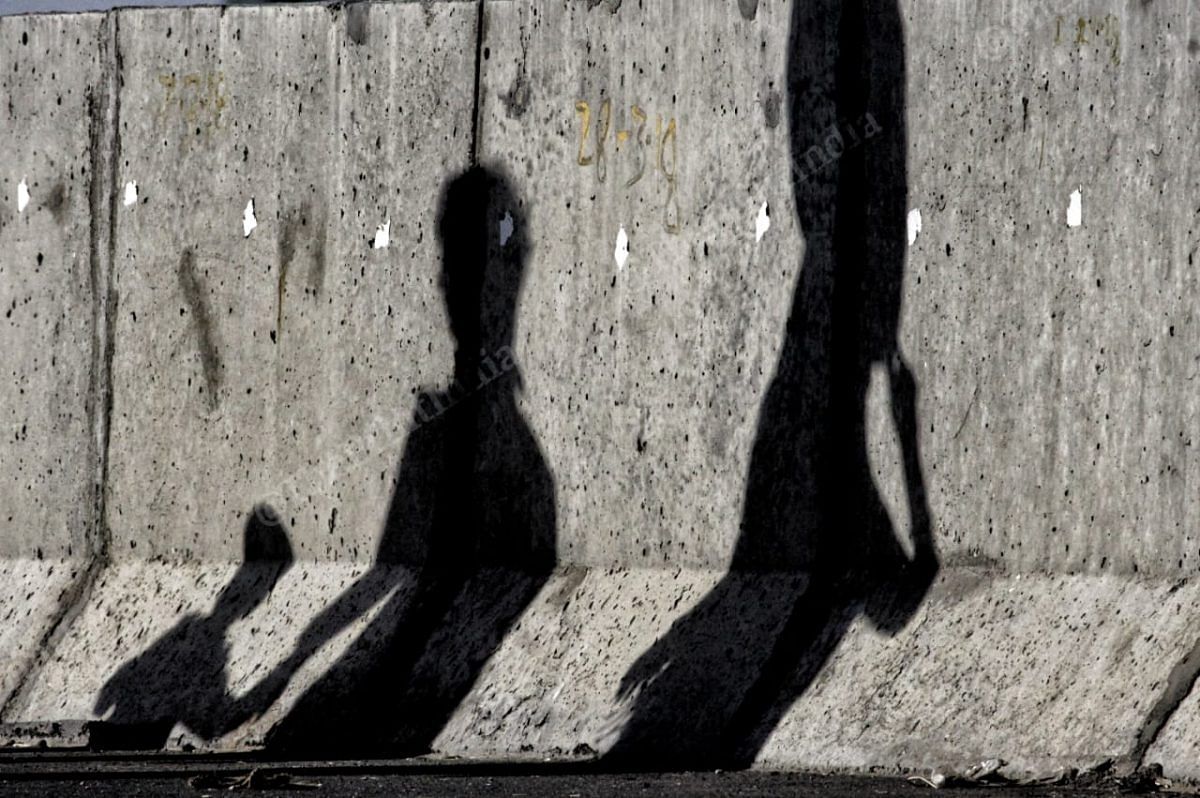 Shadow of a family, walking on the highway of Agra- Lucknow coming from Delhi | Photo: Praveen Jain | ThePrint