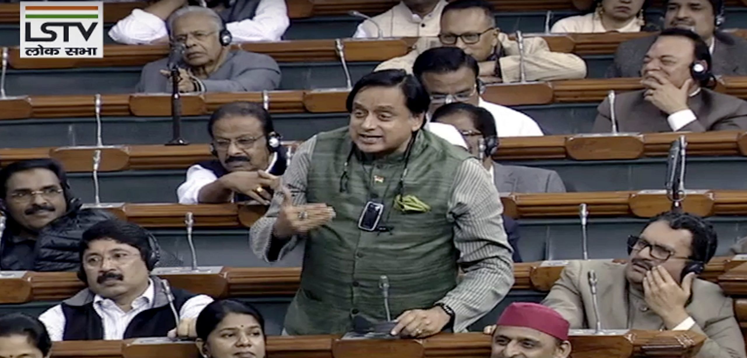 Congress MP Shashi Tharoor with his portable air purifier in Parliament last month 
