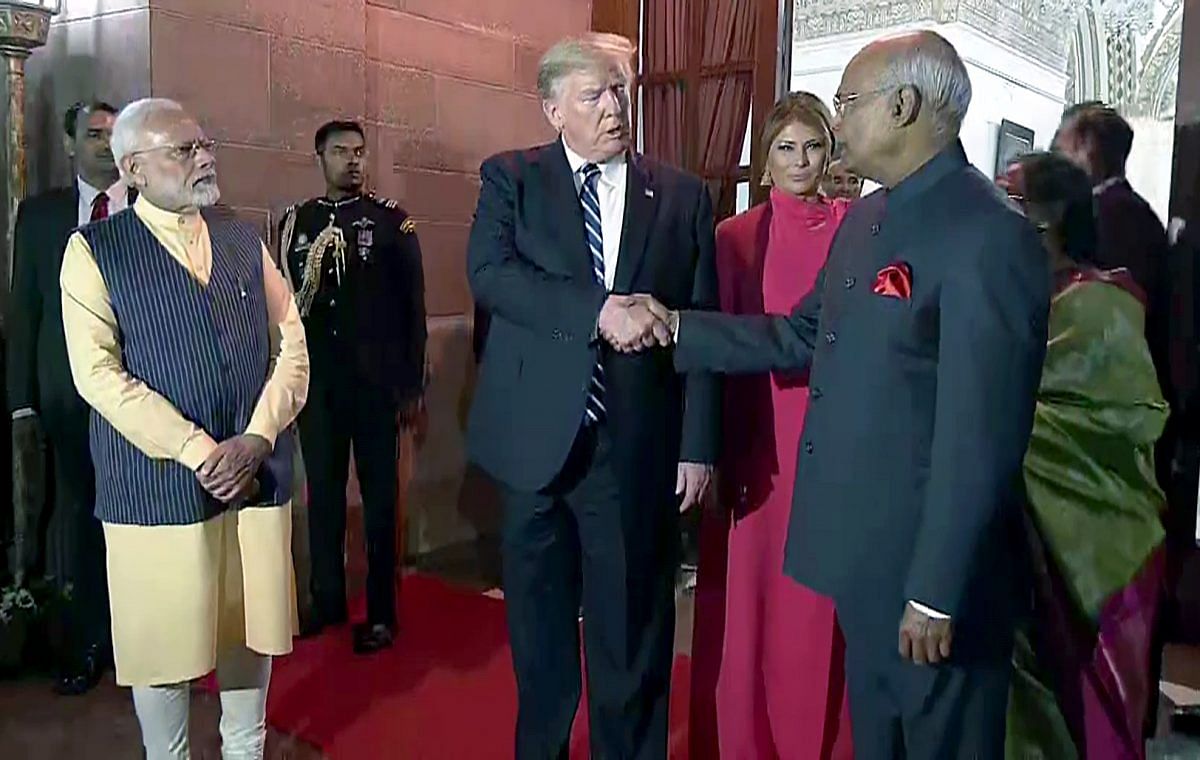 US President Donald Trump shakes hand with President Ram Nath Kovind at the Rashtrapati Bhavan | Photo: ANI