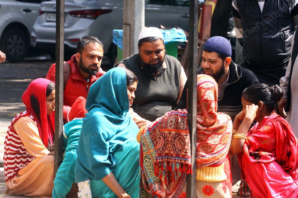 Muslim men try to console grieving Prem Singh's family | Photo: Praveen Jain | ThePrint