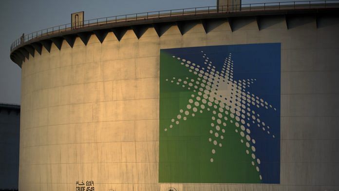 A logo sits on display outside an oil storage tank in the Juaymah tank farm at Saudi Aramco's Ras Tanura oil refinery and terminal at Ras Tanura, Saudi Arabia