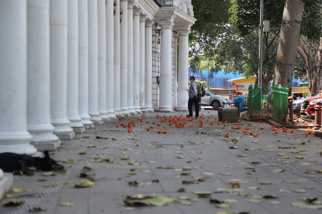 A man wearing mask walks in Connaught Place | Photo: Manisha Mondal | ThePrint