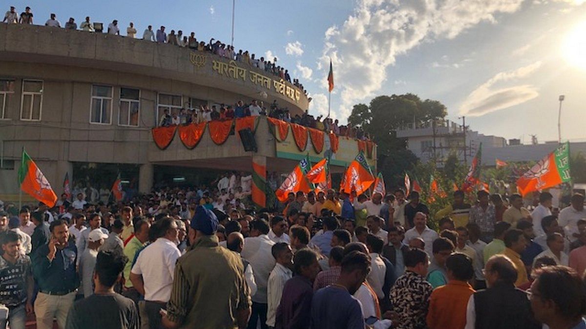 Workers gather at the Madhya Pradesh BJP headquarters in Bhopal to welcome Jyotiraditya Scindia | Photo: Ruhi Tewari | ThePrint