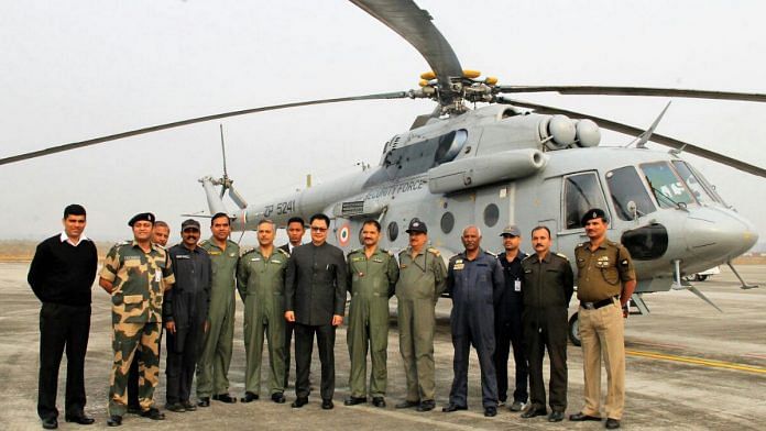 Union minister Kiren Rijiju with officers in front of a BSF Air Wing helicopter (representational image) | Photo: Commons