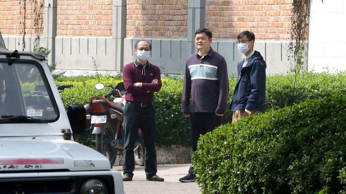 China embassy staff members in New Delhi wearing masks in the wake of coronavirus | Photo: ANI