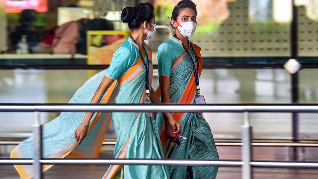 Airline employees seen wearing masks as a precautionary measure against coronavirus at Mumbai international airport