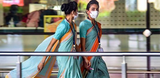 Airline employees seen wearing masks as a precautionary measure against coronavirus at Mumbai international airport
