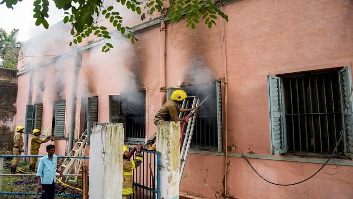 Firefighters try to douse the fire at Dum Dum correctional facility on 21 March, the first day of a clash between inmates and police personnel