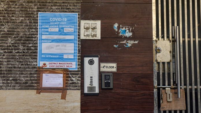 A board put up by the District Magistrate (East Delhi) at the house of a coronavirus-affected patient in east Delhi | Manvender Vashist | PTI