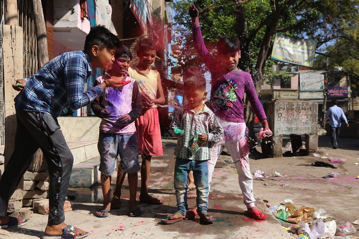 Children play holi | Photo: Manisha Mondal | ThePrint