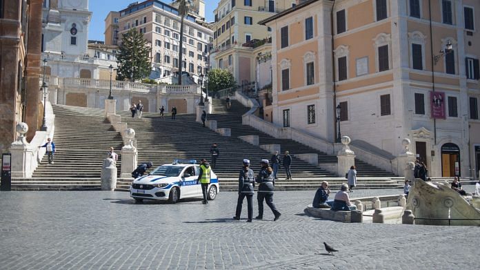 A police car sits at the bottom of the Spanish Steps in Rome