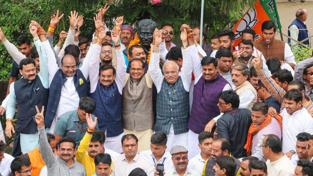 BJP leaders Shivraj Singh Chouhan, V.D. Sharma, Gopal Bhargava and others celebrate at the party headquarters in Bhopal after Madhya Pradesh CM Kamal Nath's resignation Friday