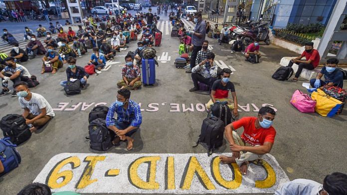 Migrants wait in a queue to board trains to Assam and Meghalaya from Central Railway Station in Chennai during the nationwide Covid-19 lockdown, on 13 May, 2020 | R Senthil Kumar | PTI