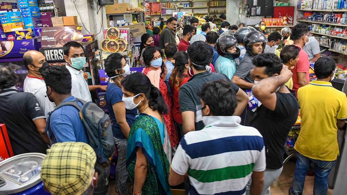 Locals throng a grocery store after PM Modi’s announcement of 21 days of lockdown in wake of coronavirus, in Patna | PTI