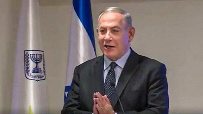 Israeli Prime Minister Benjamin Netanyahu encourages his countrymen to adopt 'Namaste', during a press conference, in Jerusalem, Wednesday to prevent the spread of the deadly coronavirus