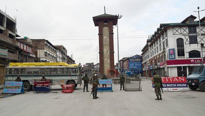 Security forces stand guard at Srinagar's Lal Chowk. J&K has announced a lockdown in the wake of the coronavirus spread | Photo: ANI
