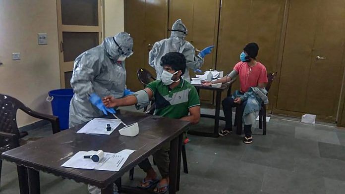 In this handout photo provided by ITBP, medics screen patients for COVID-19 at a quarantine facility at Chhawla in New Delhi | PTI