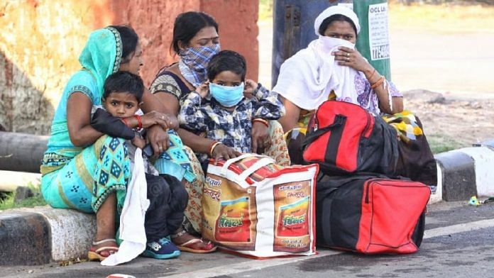 Women sit with their children on a footpath in Agra | Praveen Jain | ThePrint