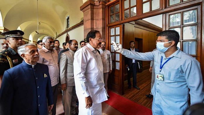 An official does a thermal screening of Vice President M Venkaiah Naidu in Parliament House in New Delhi as a part of the measures to tackle coronavirus on 18 March 2020 | Arun Sharma | PTI