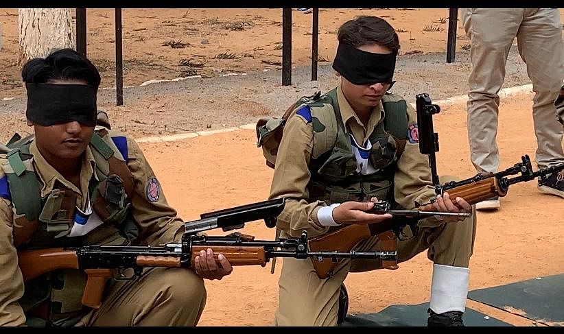 The recruits receive weapons training in blindfold
