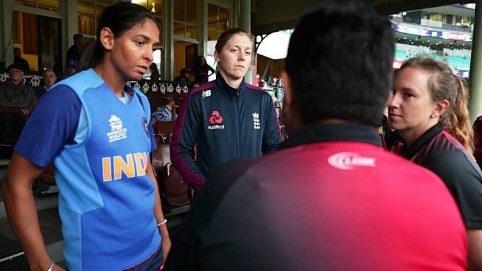 India captain Harmanpreet Kaur (left) and England captain Heather Knight (centre) speak to umpires as rain forces the abandonment of their ICC Women's T20 World Cup semi-final in Sydney | Photo: ICC (via ANI)
