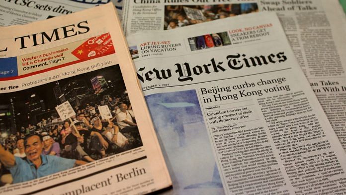 Copies of various newspapers including Financial Times (left) and International New York Times (right). | Photographer: May Tse | South China Morning Post via Getty Images | Bloomberg