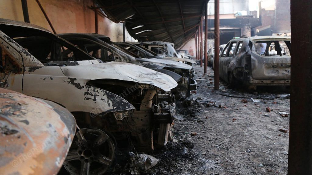 Cars torched during Delhi riots in Shivpuri | Photo: Manisha Mondal | ThePrint