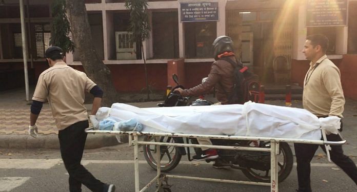 A file photo of a body being taken to GTB hospital in New Delhi. | Photo: Sanya Dhingra | ThePrint