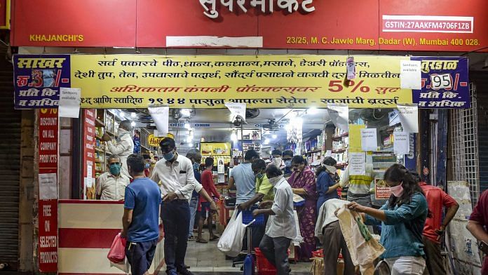 Locals buy vegetables and essential goods at a market after the announcement of lockdown in wake of coronavirus pandemic, at Worli in Mumbai. | PTI