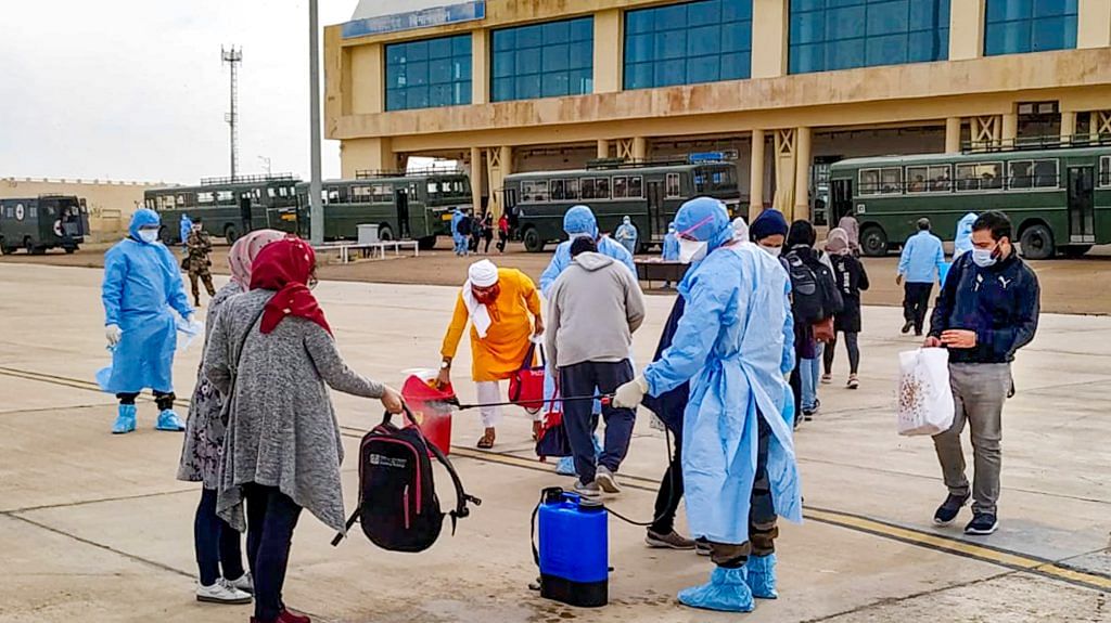 Indian nationals evacuated from Iran undergo a disinfectant process before being quarantined in Indian Army Wellness Facility Centre at Jaisalmer Military Station