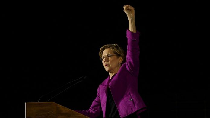 Senator Elizabeth Warren, a Democrat from Massachusetts and 2020 presidential candidate, gestures as she speaks during a campaign event. | Photographer: Patrick T. Fallon | Bloomberg