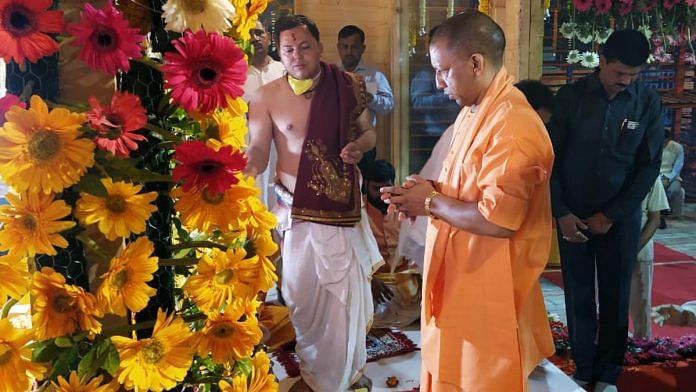 Uttar Pradesh Chief Minister Yogi Adityanath offers prayers at a temple in Ayodhya on Wednesday. | Photo: ANI